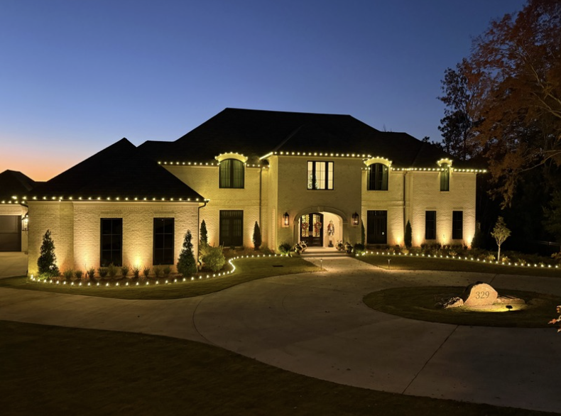 Large estate home with extensive roofline lighting